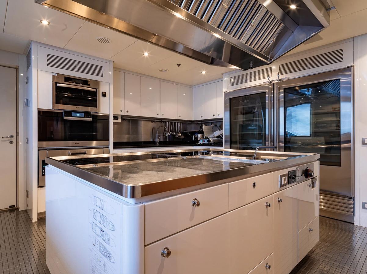 a kitchen with a large oven aboard MONEIKOS Yacht for Sale