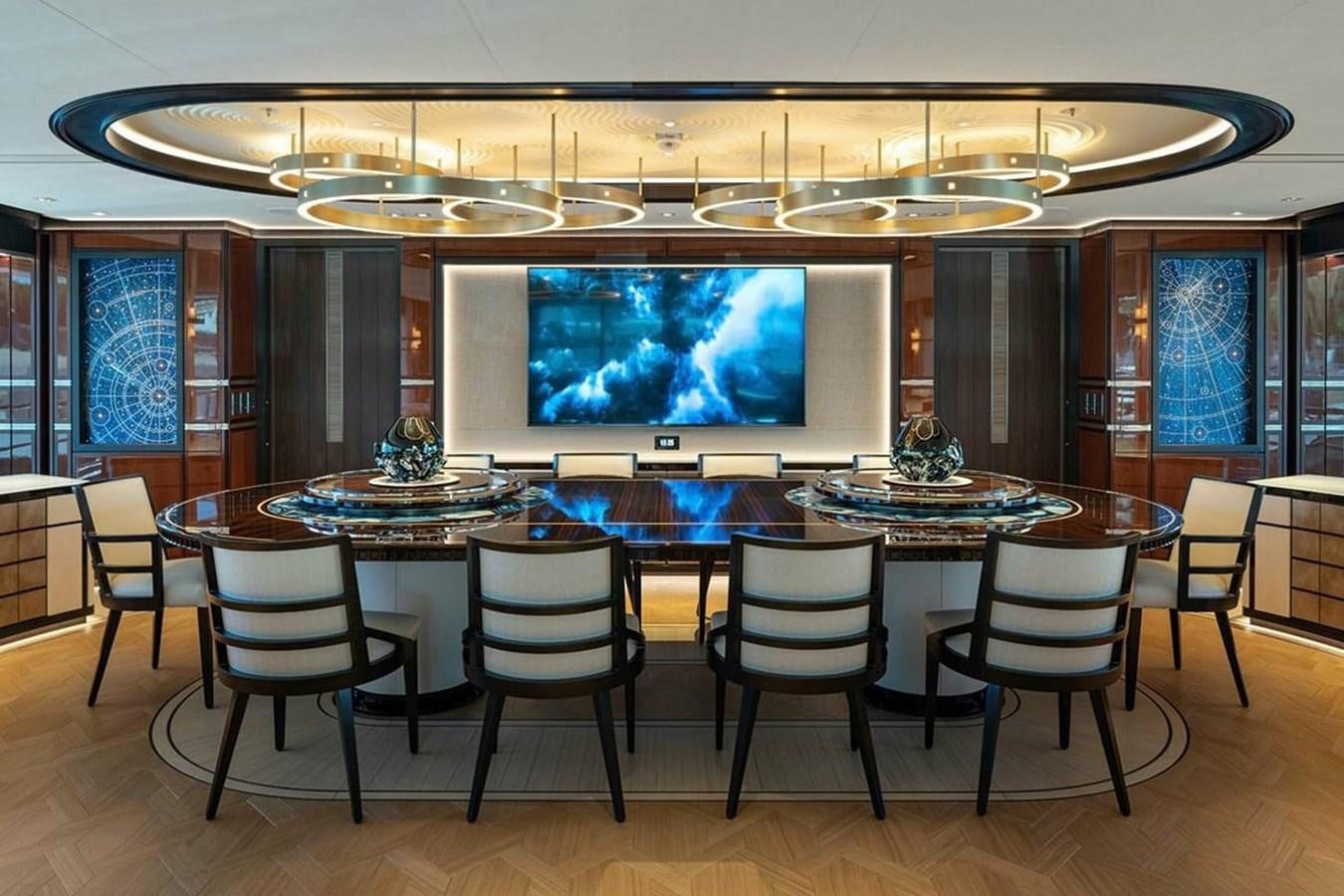 a room with a table and chairs aboard LUSINE Yacht for Sale