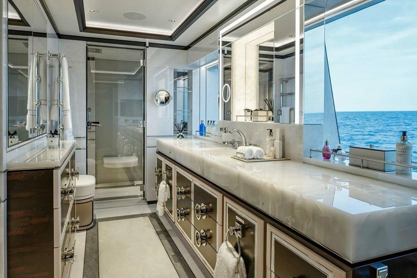 a bathroom with a large window aboard LUSINE Yacht for Sale