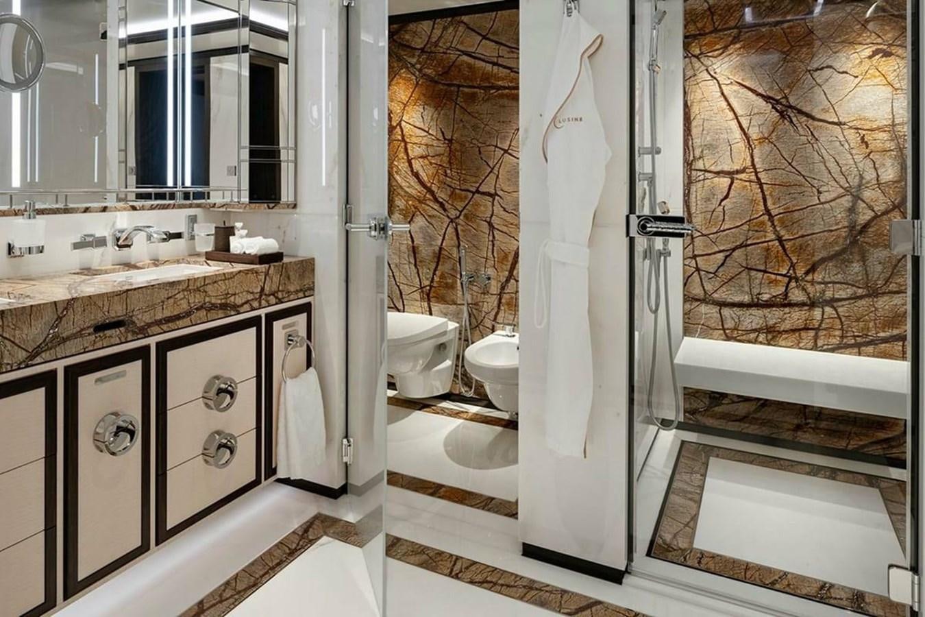 a bathroom with a sink toilet and a bathtub aboard LUSINE Yacht for Sale