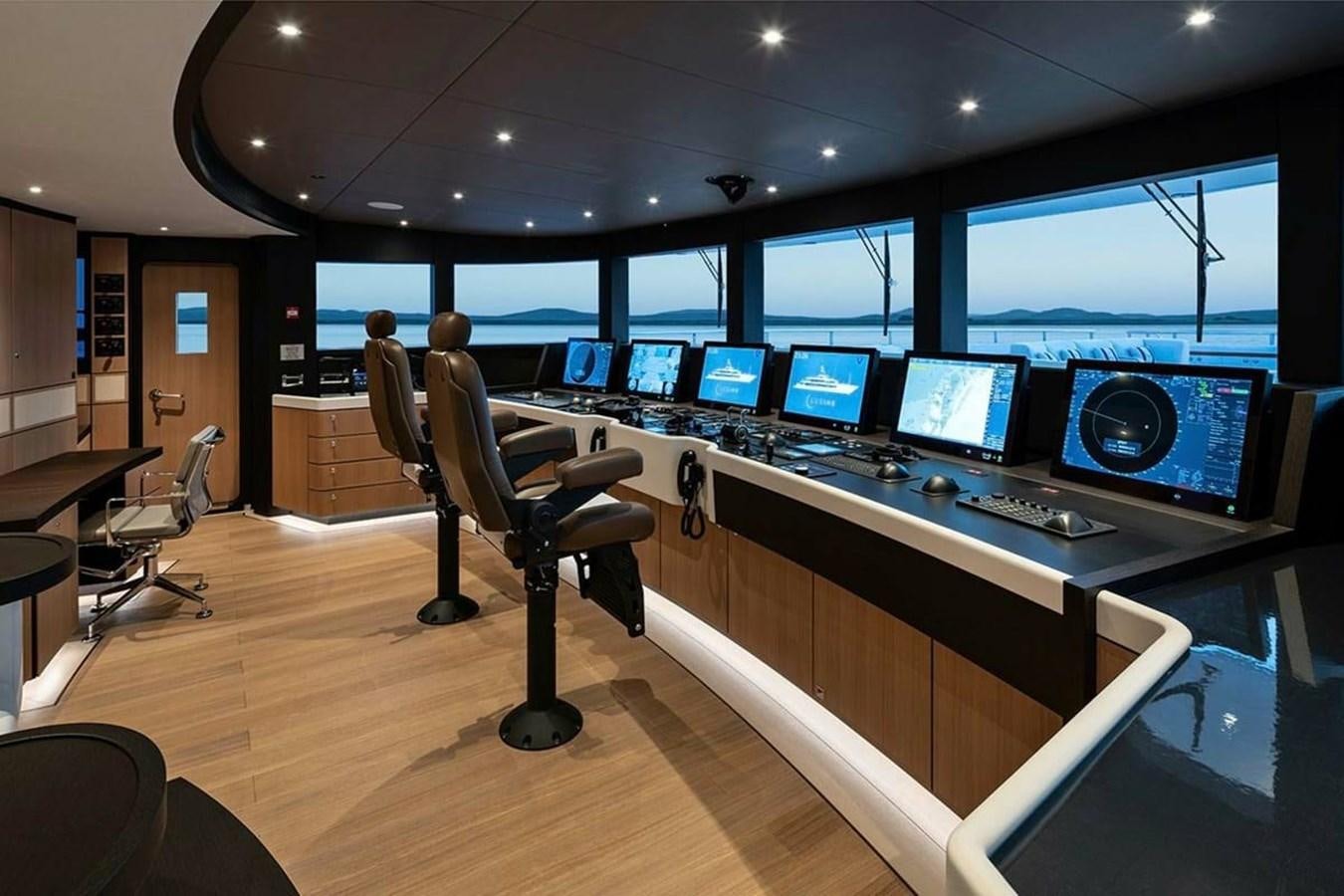 a room with many computer screens aboard LUSINE Yacht for Sale