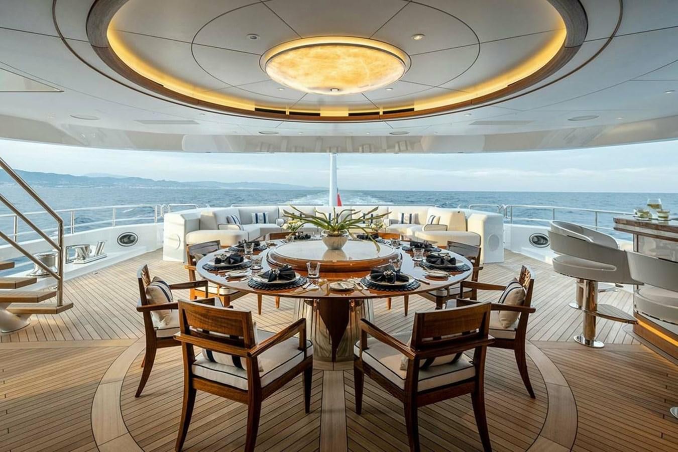 a room with a table and chairs aboard LUSINE Yacht for Sale