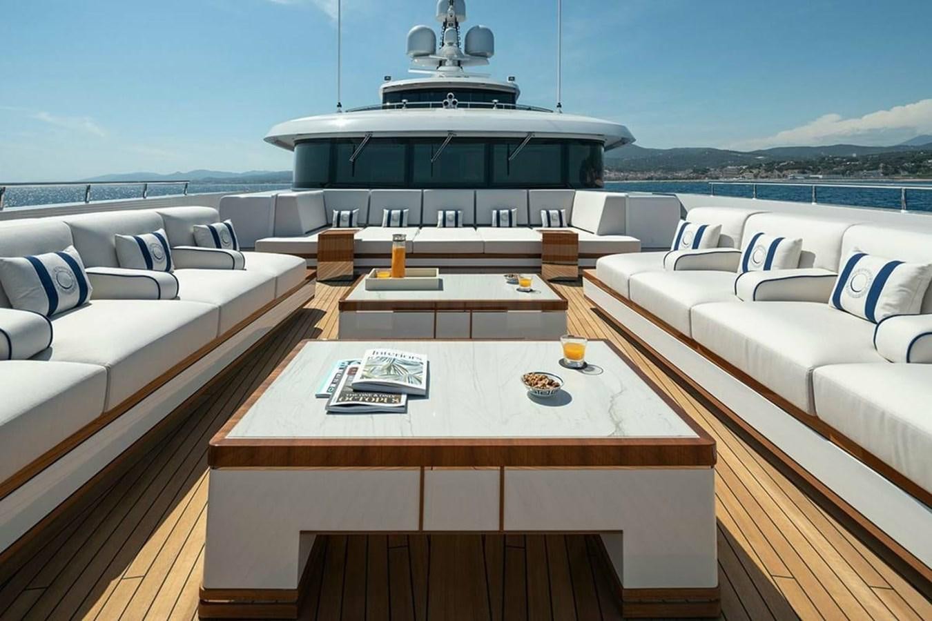 a room with a table and chairs aboard LUSINE Yacht for Sale