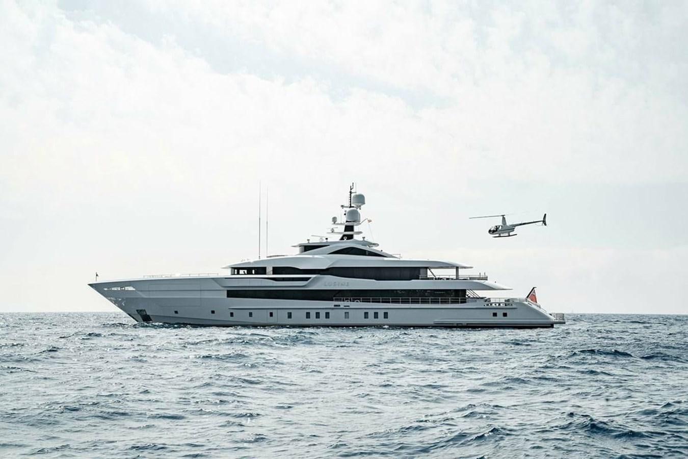 a helicopter flying over a boat aboard LUSINE Yacht for Sale