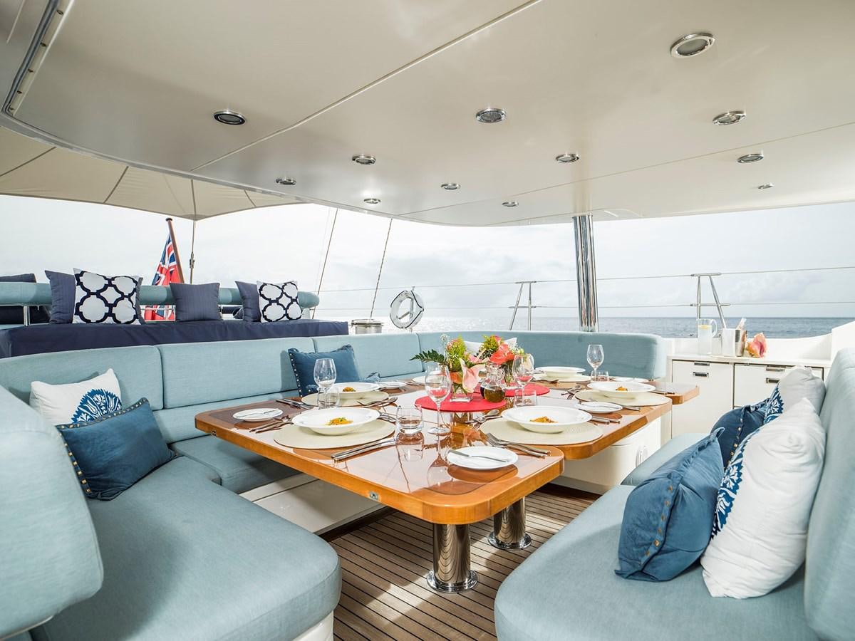 a room with a table and chairs aboard TWILIGHT Yacht for Sale
