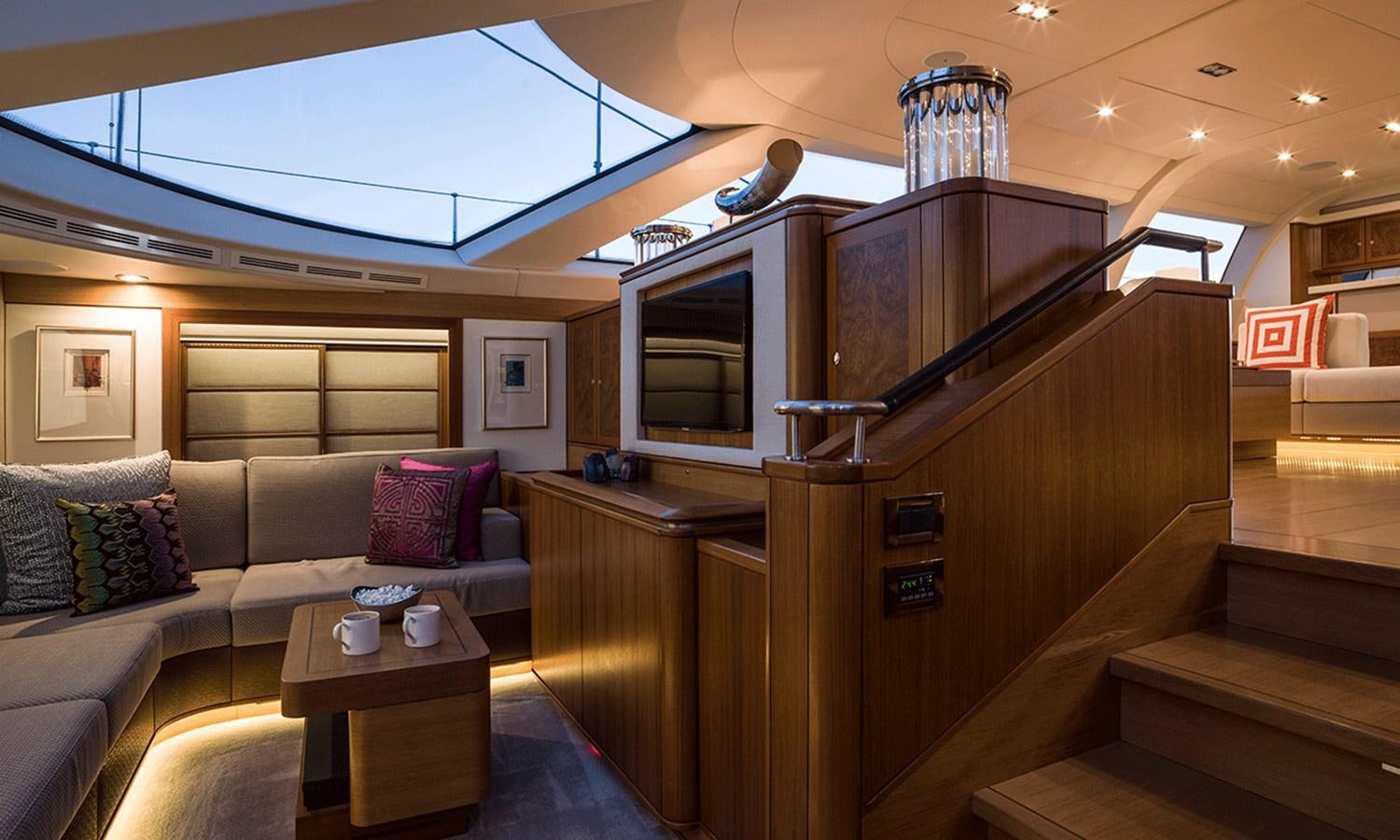 a living room with a couch and a coffee table aboard TWILIGHT Yacht for Sale