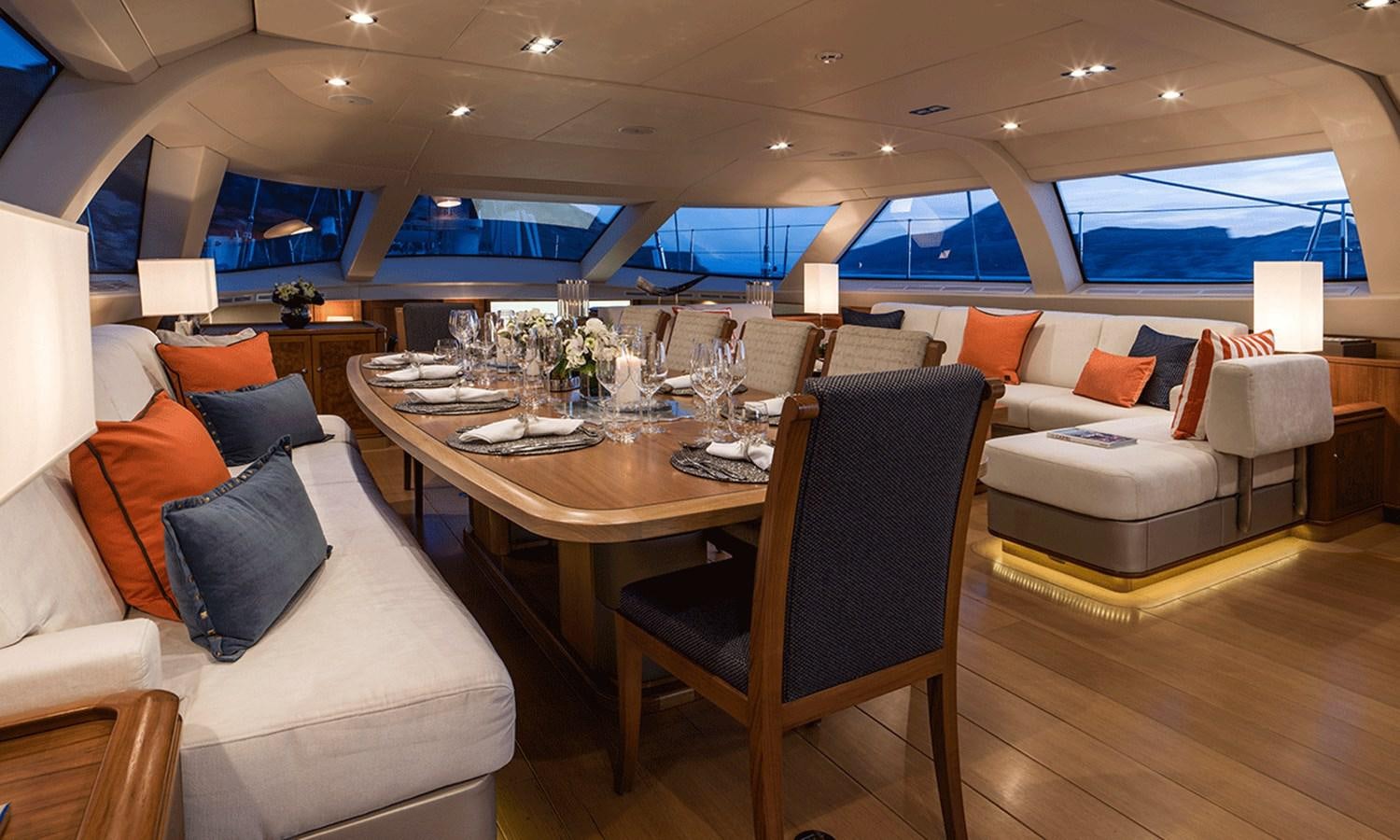 a dining room with a table and chairs aboard TWILIGHT Yacht for Sale