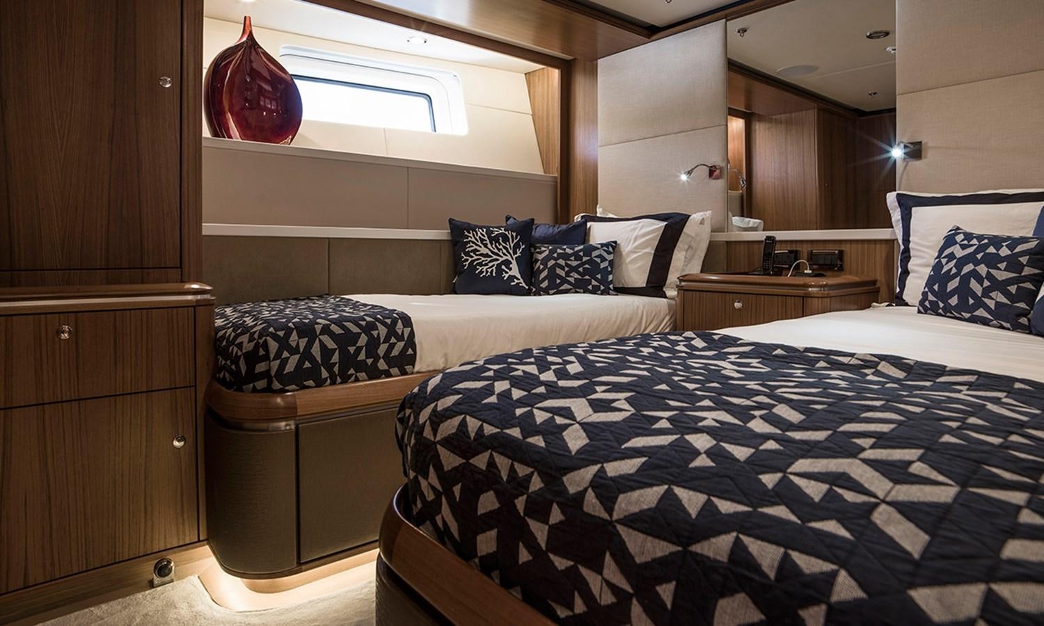 a bedroom with two beds aboard TWILIGHT Yacht for Sale