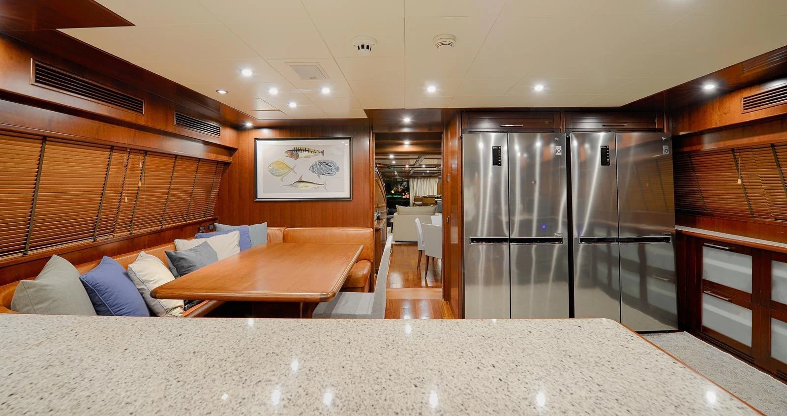 a large room with a couch and a refrigerator aboard HAG Yacht for Sale