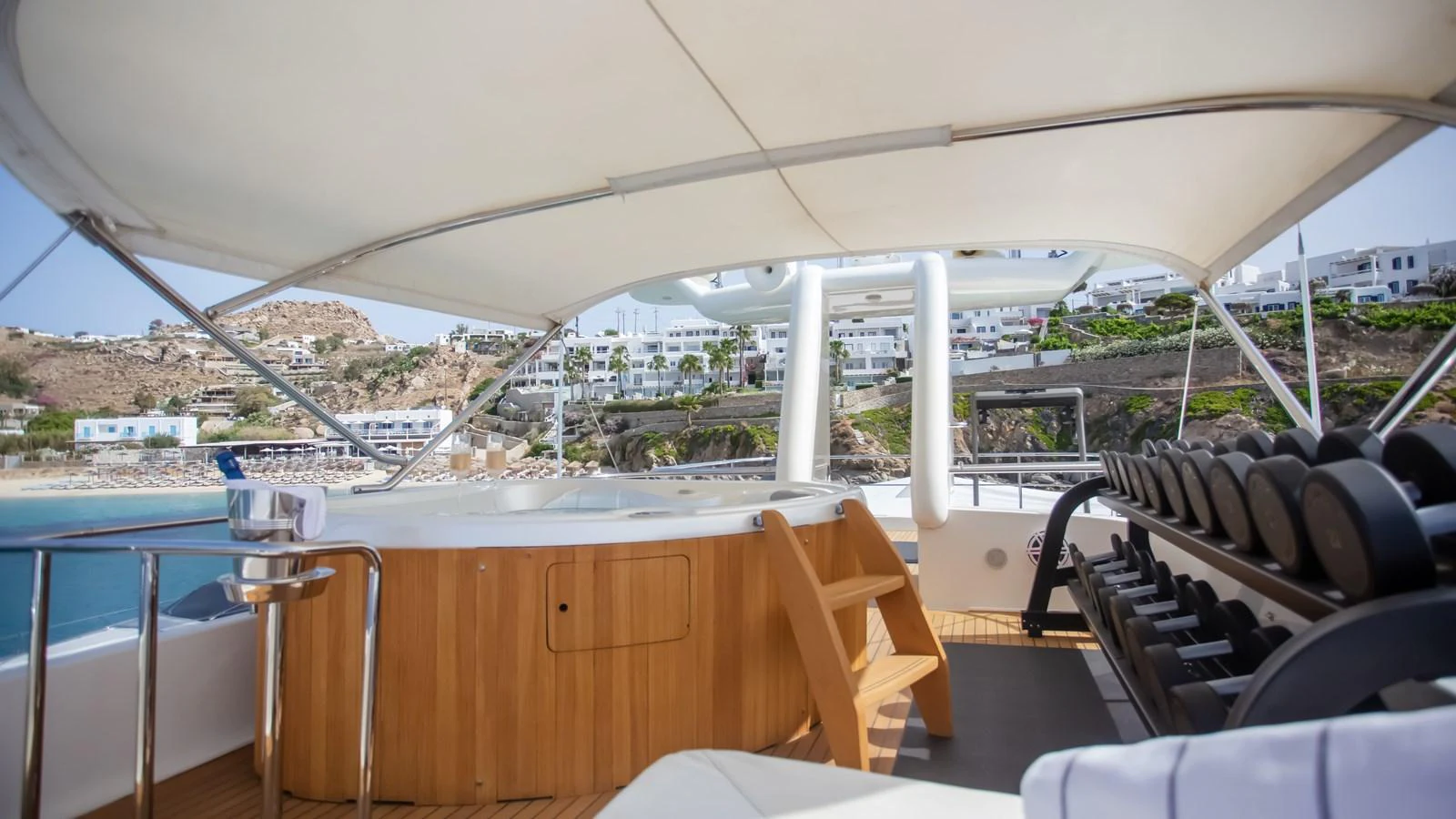 a room with a large white tent and chairs and tables aboard HAG Yacht for Sale