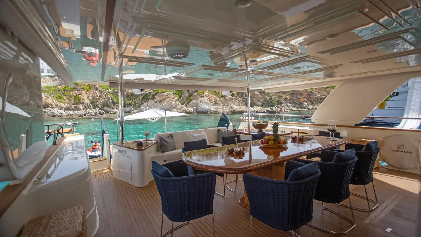 a room with a table and chairs aboard HAG Yacht for Sale