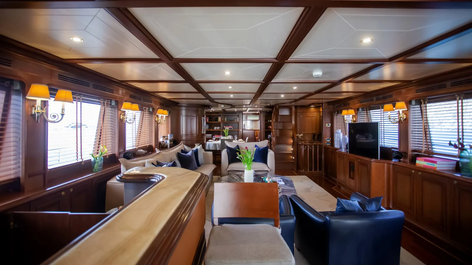 a room with a table and chairs aboard HAG Yacht for Sale
