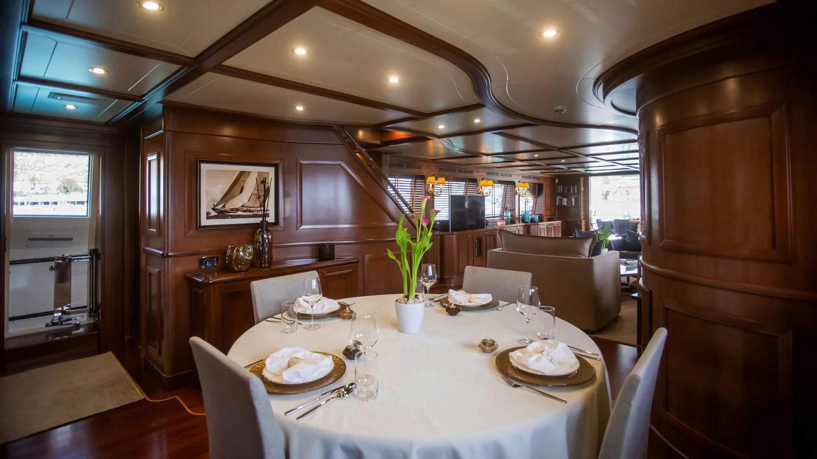 a dining room with a table set aboard HAG Yacht for Sale