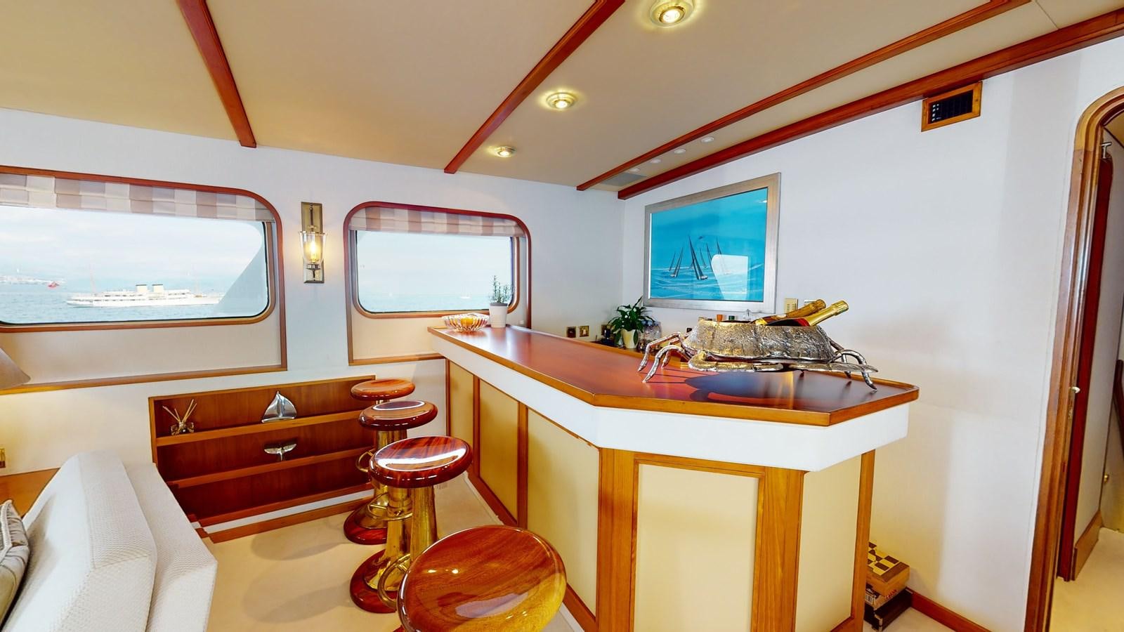 a small kitchen with a sink and a large window aboard WILAMINA Yacht for Sale