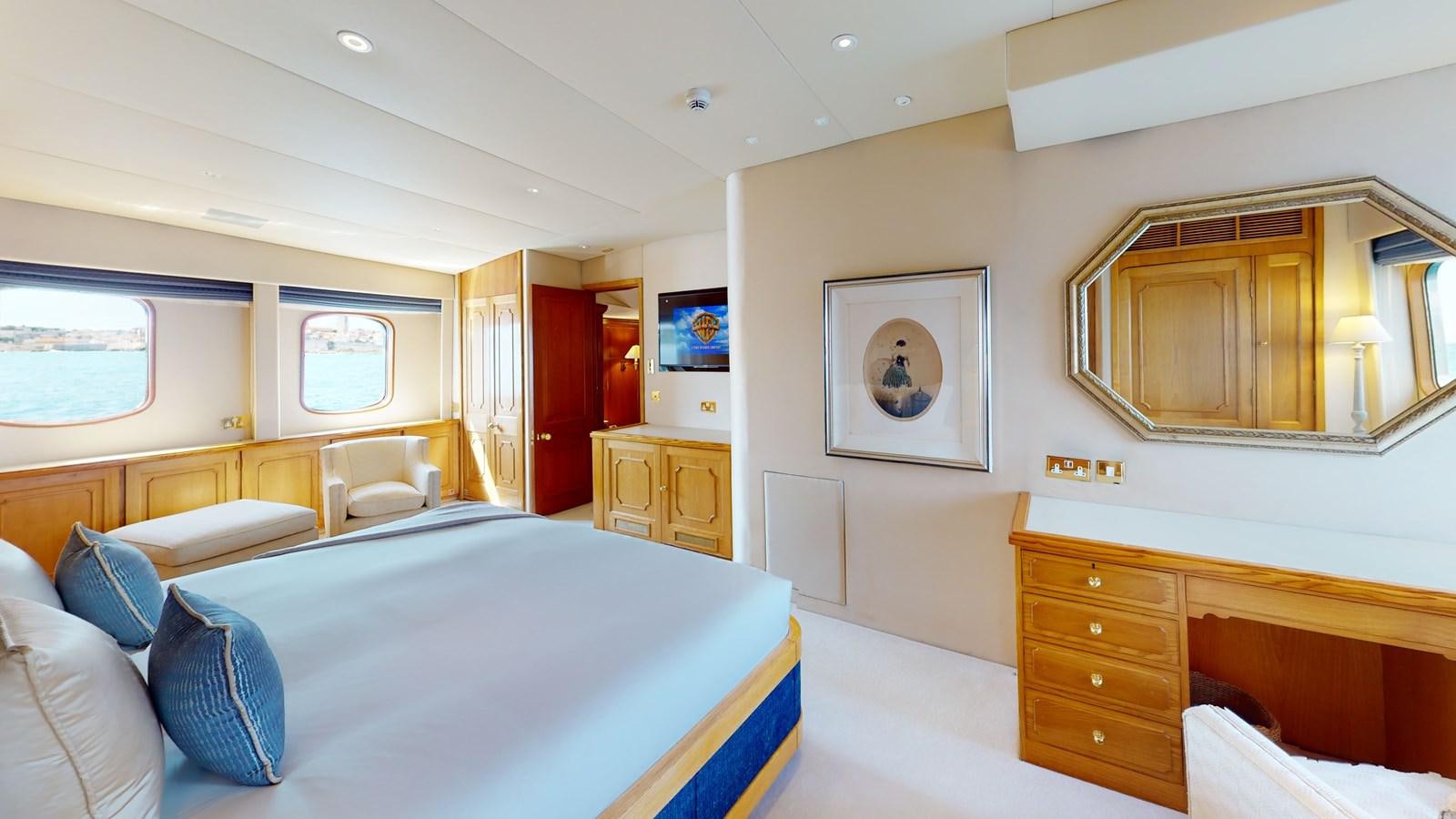 a room with a bed and a desk aboard WILAMINA Yacht for Sale