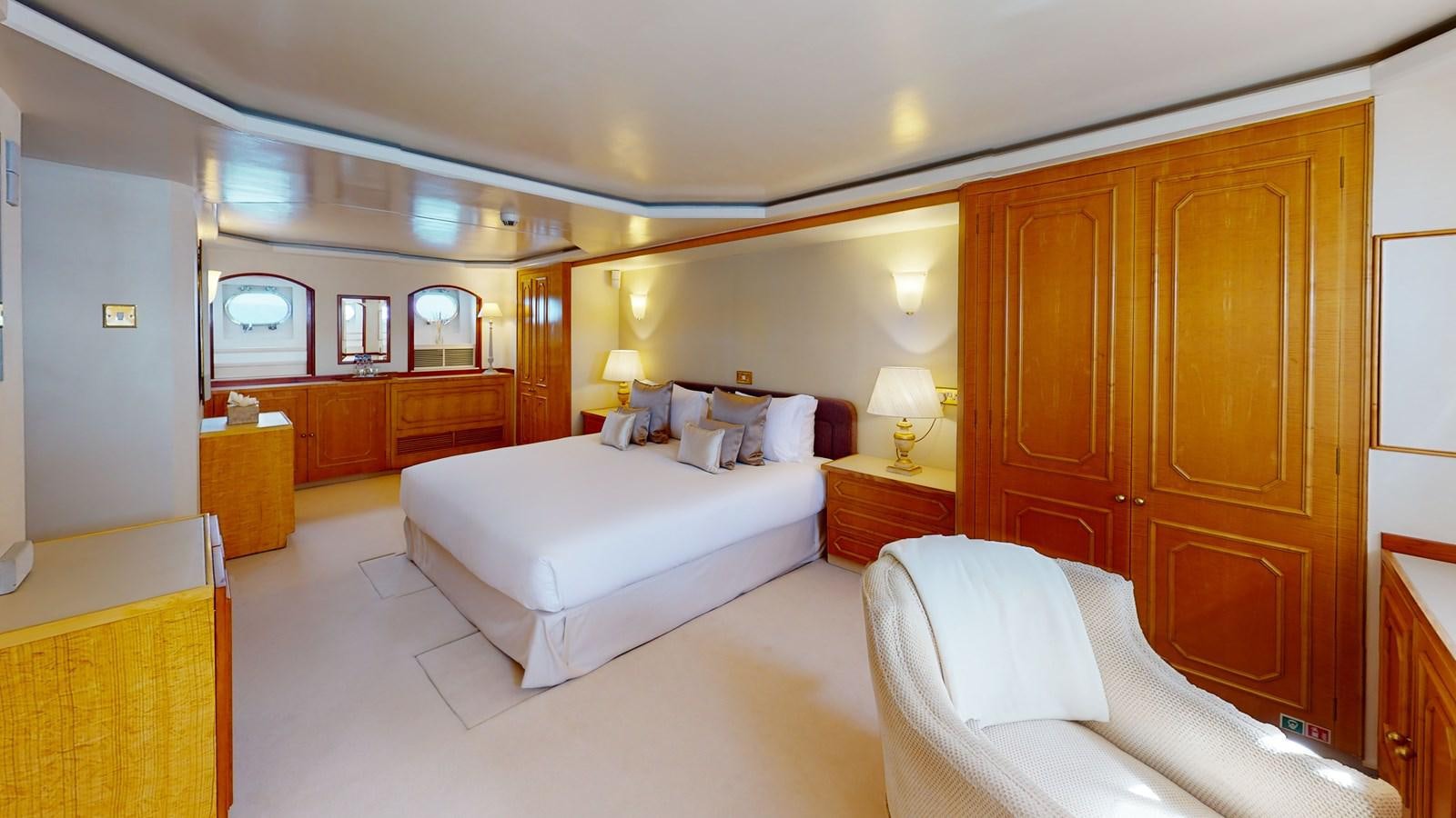 a room with a bed and a mirror aboard WILAMINA Yacht for Sale