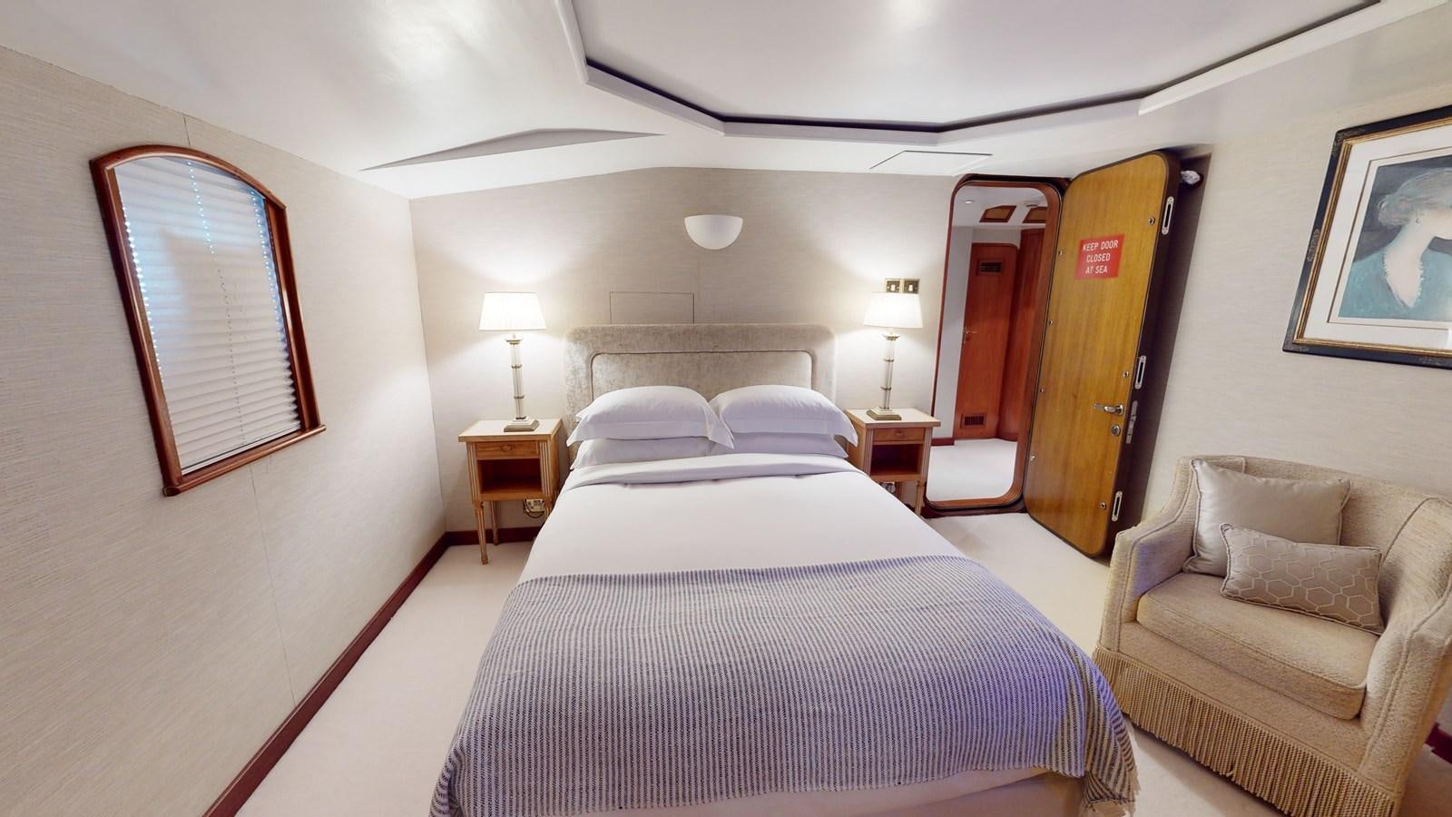 a room with a bed and a couch aboard WILAMINA Yacht for Sale