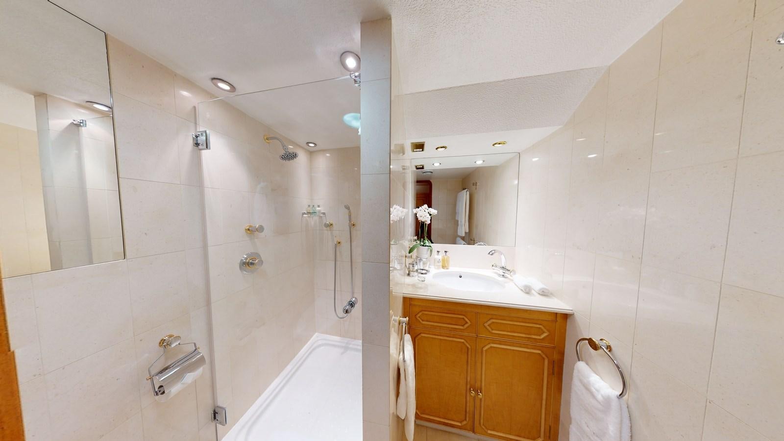 a bathroom with a bathtub sink and a shower aboard WILAMINA Yacht for Sale