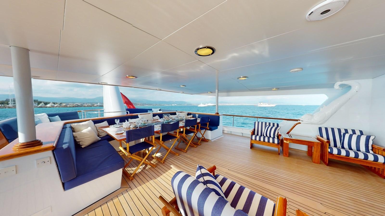 a room with a pool and chairs aboard WILAMINA Yacht for Sale
