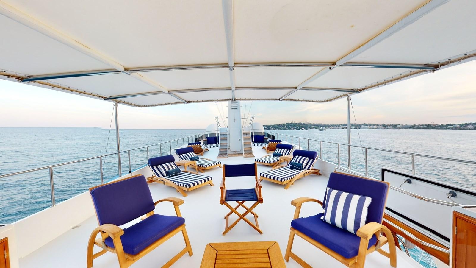 a boat with chairs on it aboard WILAMINA Yacht for Sale