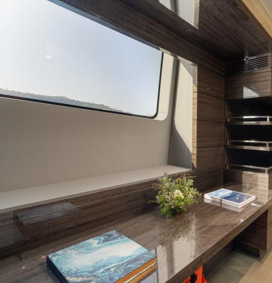 a room with a table and a window aboard EDESIA Yacht for Charter