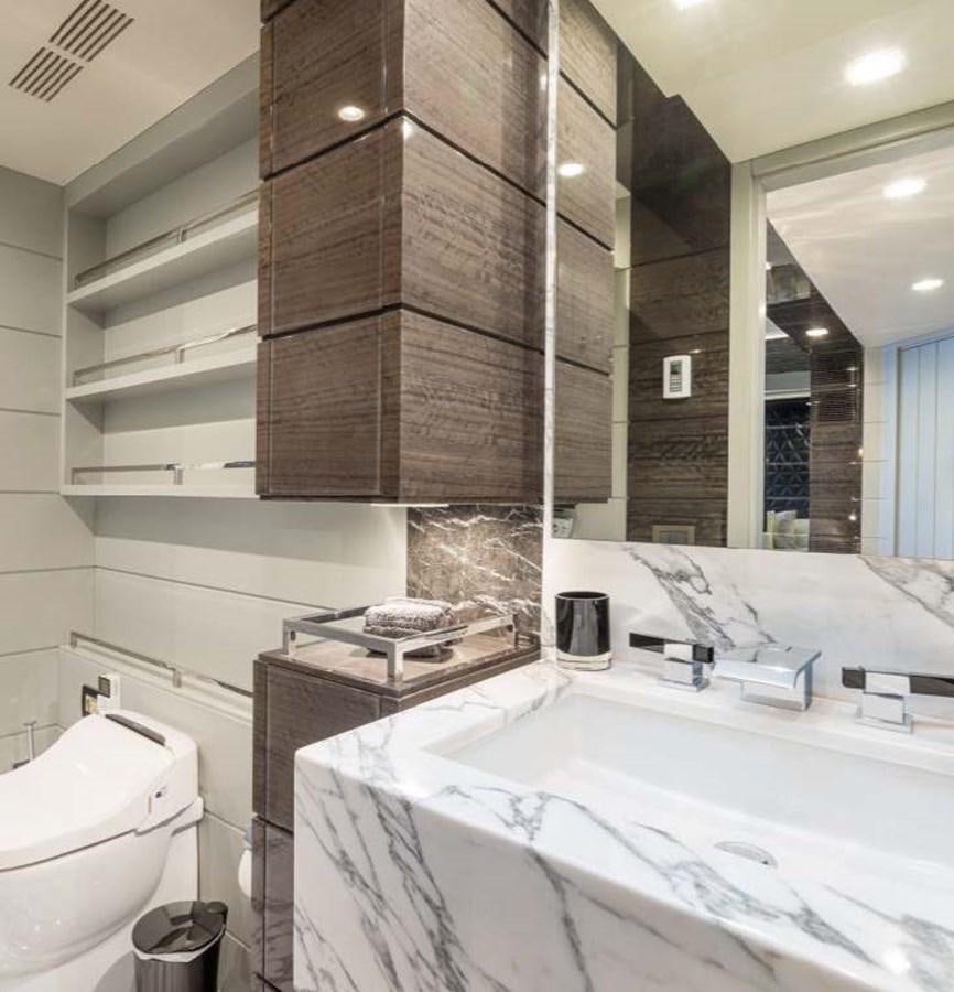 a bathroom with a large mirror aboard EDESIA Yacht for Charter