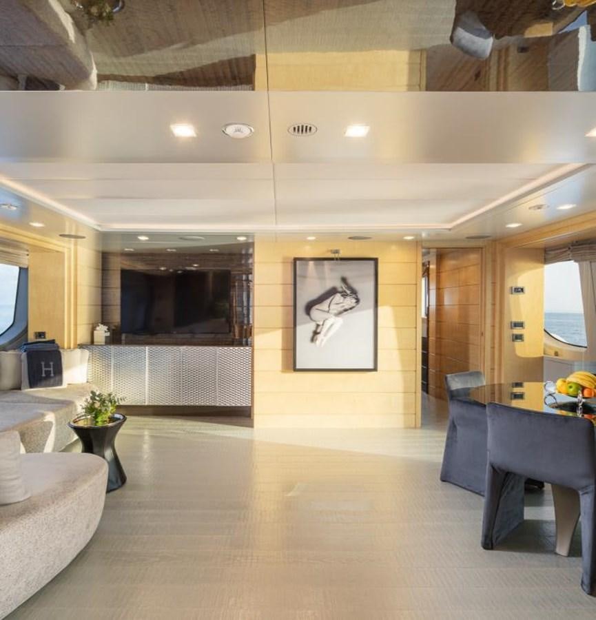 a living room with a fireplace aboard EDESIA Yacht for Charter