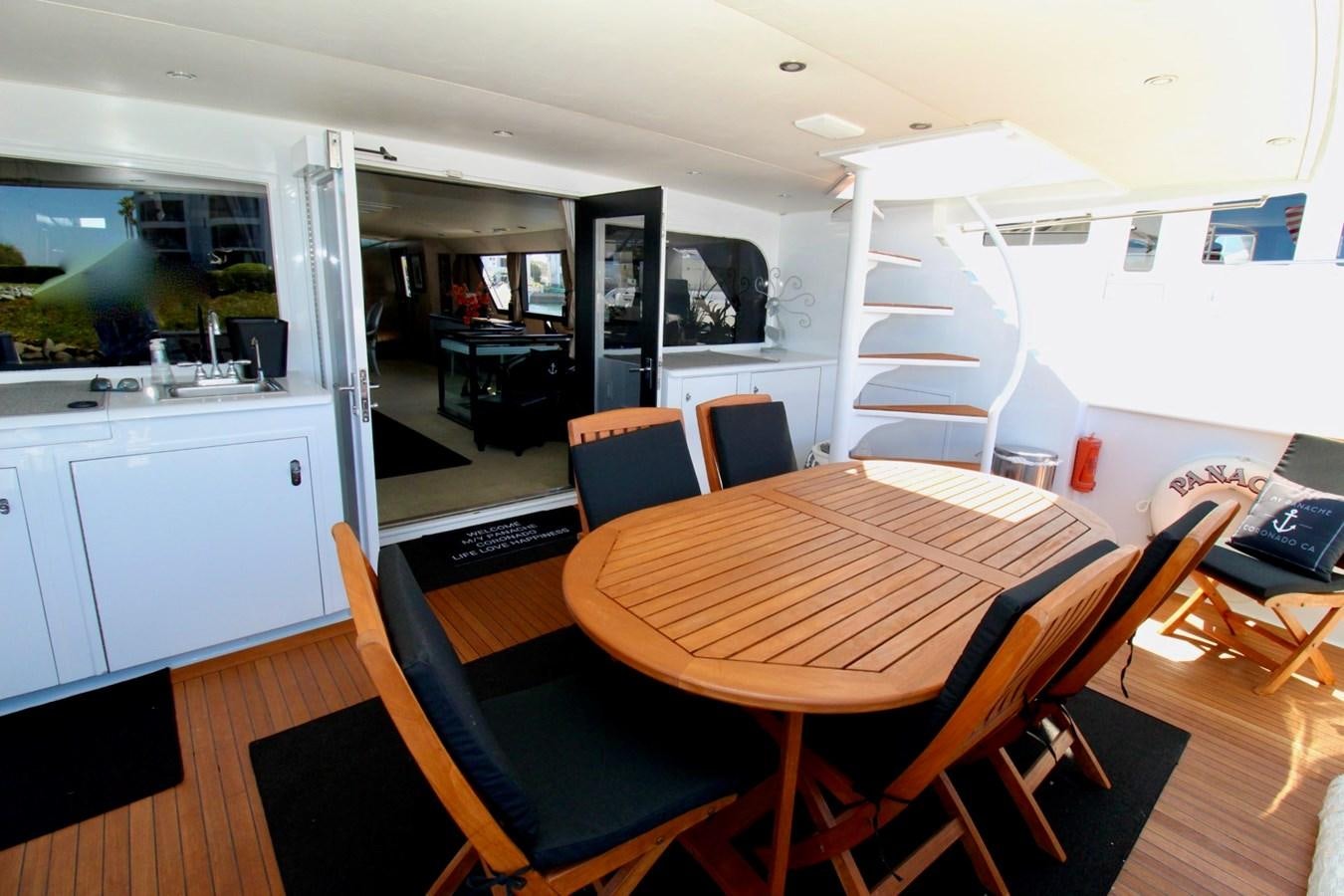 a room with a table and chairs aboard PANACHE Yacht for Sale