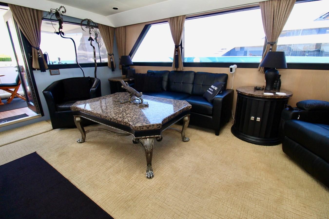 a living room with a large window aboard PANACHE Yacht for Sale