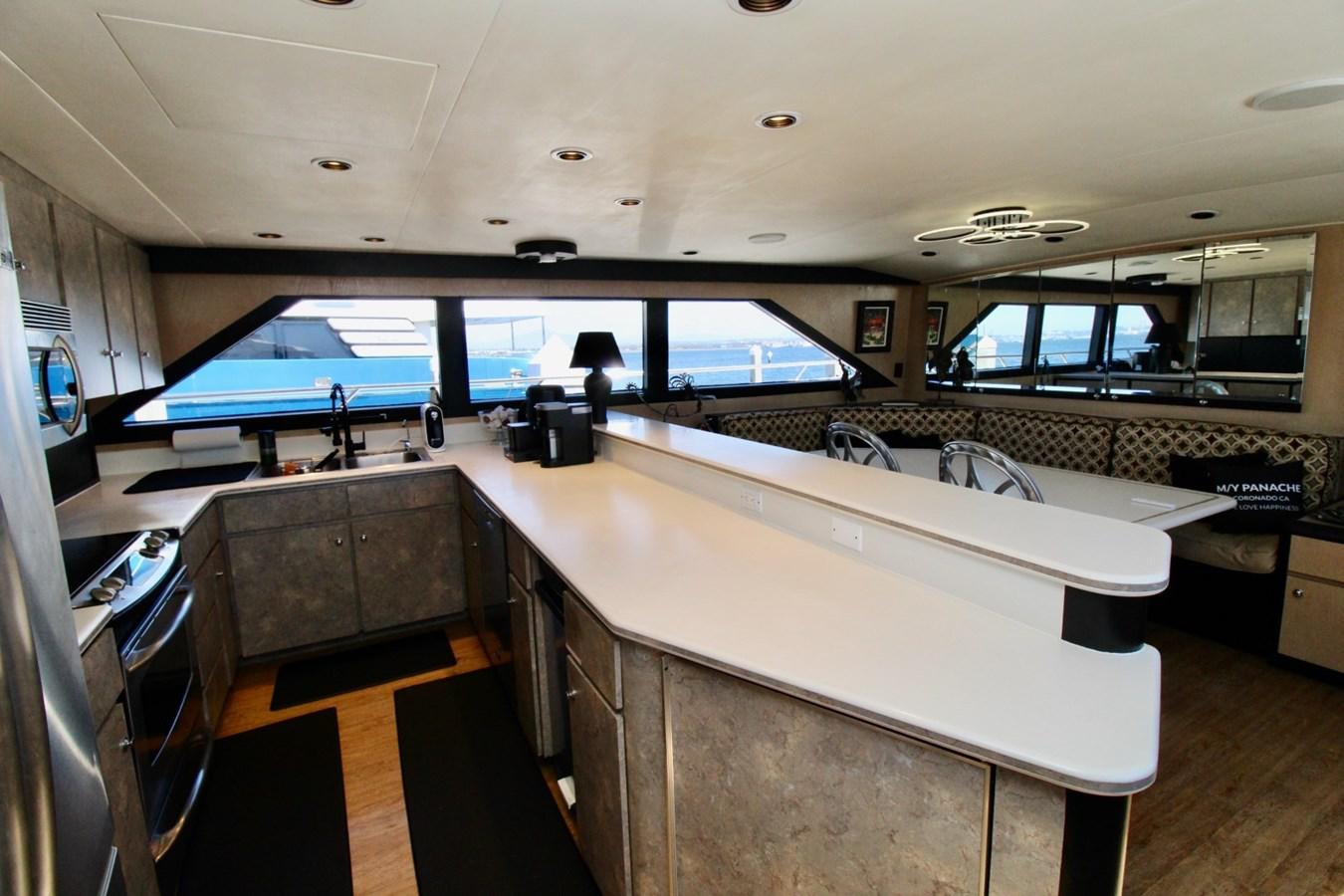 a large kitchen with a large island aboard PANACHE Yacht for Sale