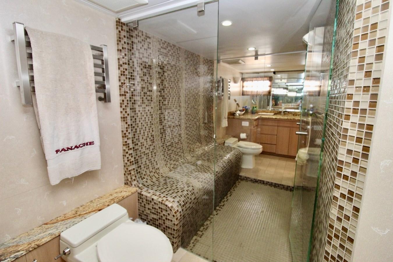a bathroom with a shower curtain aboard PANACHE Yacht for Sale