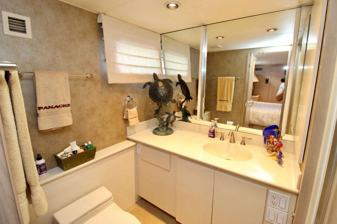 a bathroom with a large mirror aboard PANACHE Yacht for Sale