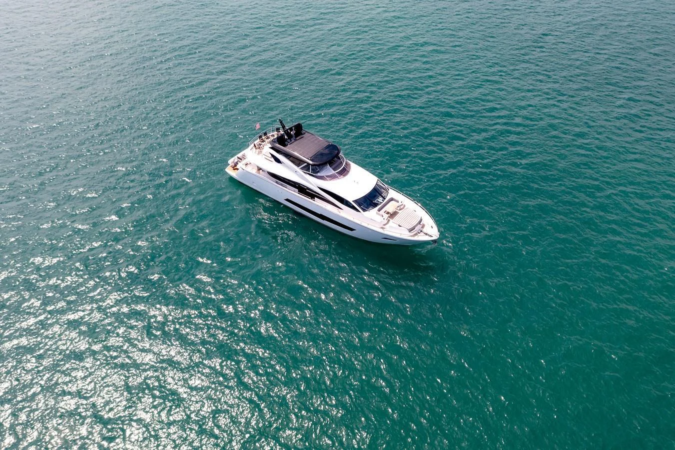 A sleek and modern yacht glides gracefully on the open water. aboard SUNSEEKER Yacht for Sale