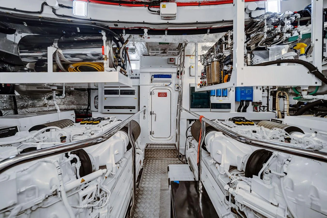 The image showcases a pristine and well-organized engine room with dual engines and advanced equipment. aboard SUNSEEKER Yacht for Sale