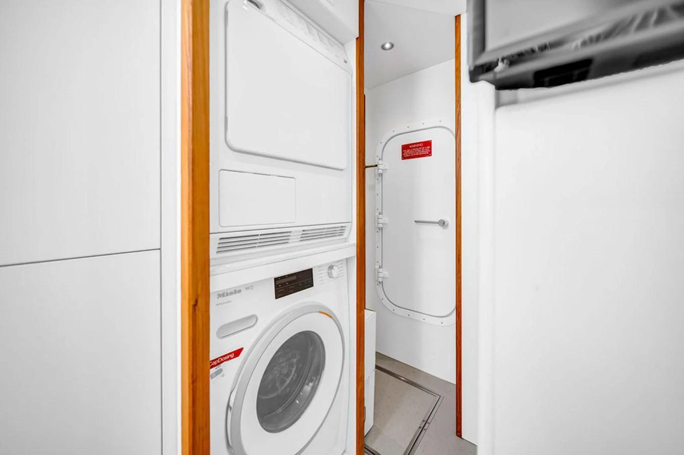 The yacht features a well-equipped laundry room with modern appliances. aboard SUNSEEKER Yacht for Sale