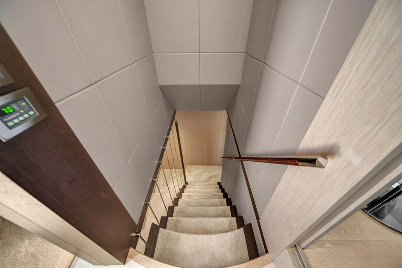 A modern staircase with sleek design elements leads to the lower deck. aboard SUNSEEKER Yacht for Sale
