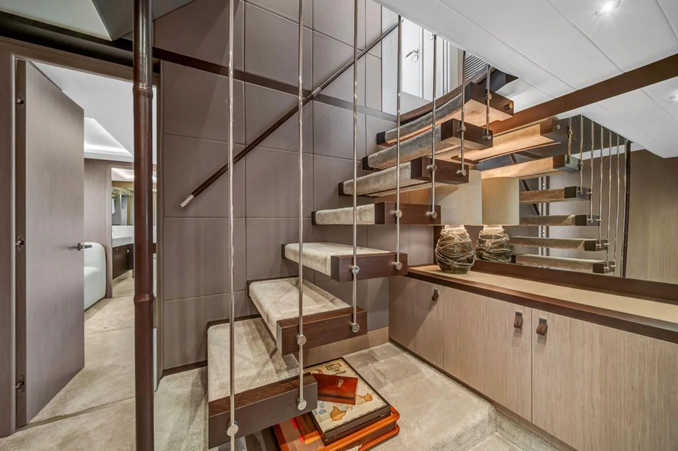 The interior features a modern staircase with sleek lines and contemporary design elements. aboard SUNSEEKER Yacht for Sale