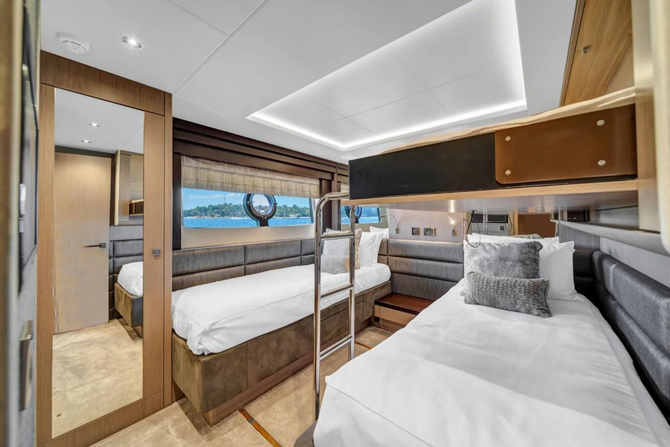 The guest stateroom features twin beds and a modern, elegant design with ample natural light. aboard SUNSEEKER Yacht for Sale