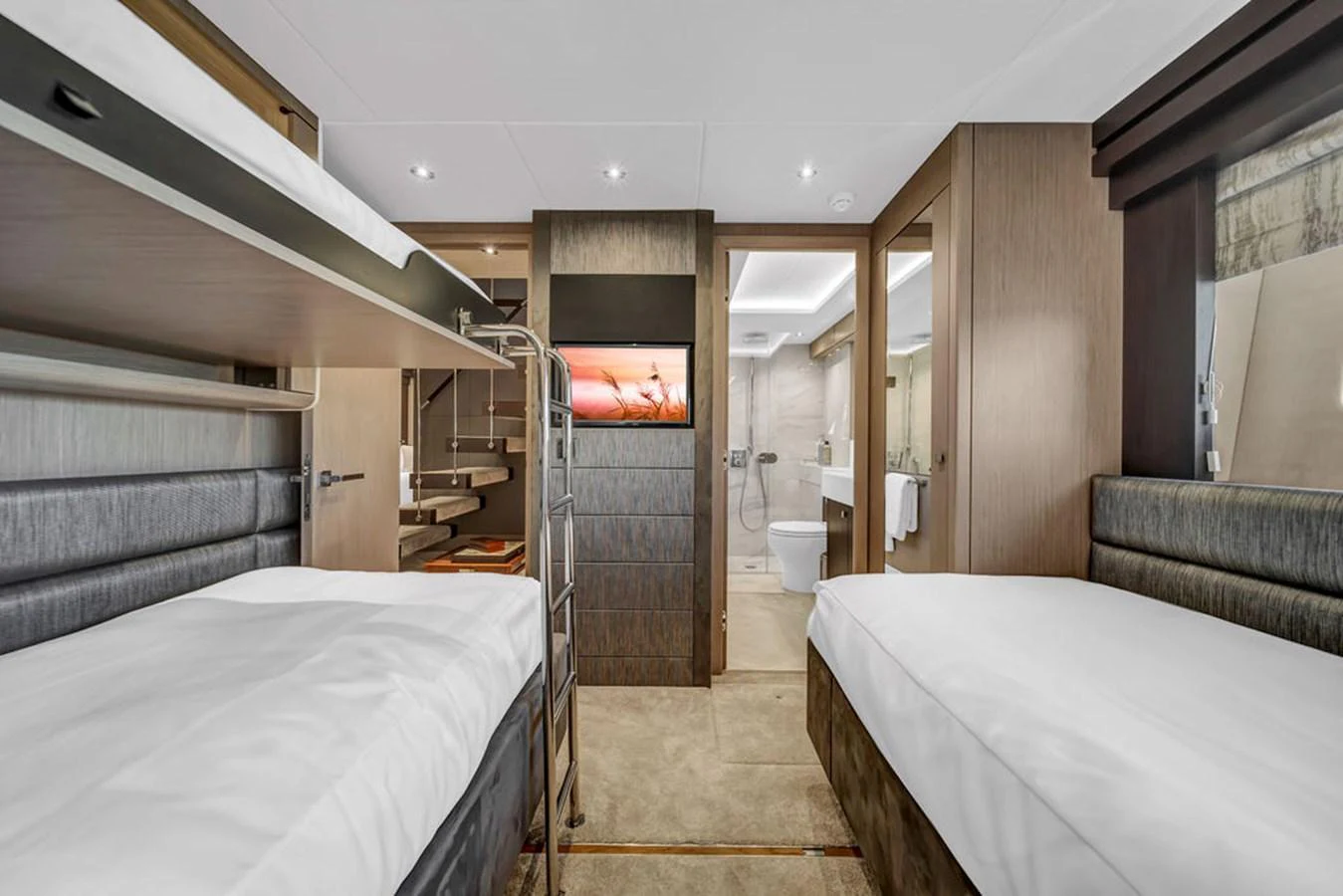 The guest stateroom features twin beds and a modern ensuite bathroom, offering comfort and privacy. aboard SUNSEEKER Yacht for Sale