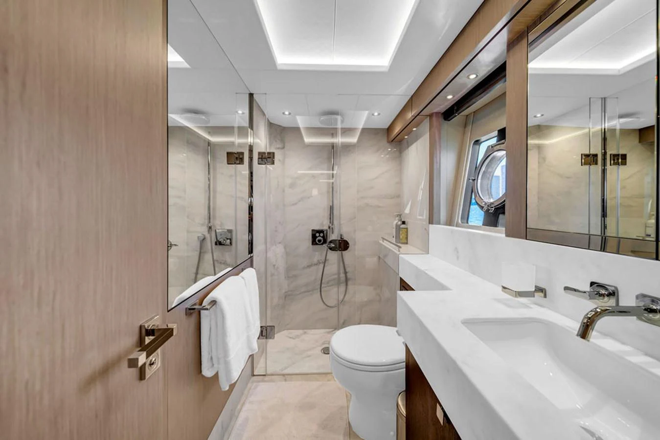 The yacht's bathroom features a sleek design with modern fixtures and ample lighting. aboard SUNSEEKER Yacht for Sale