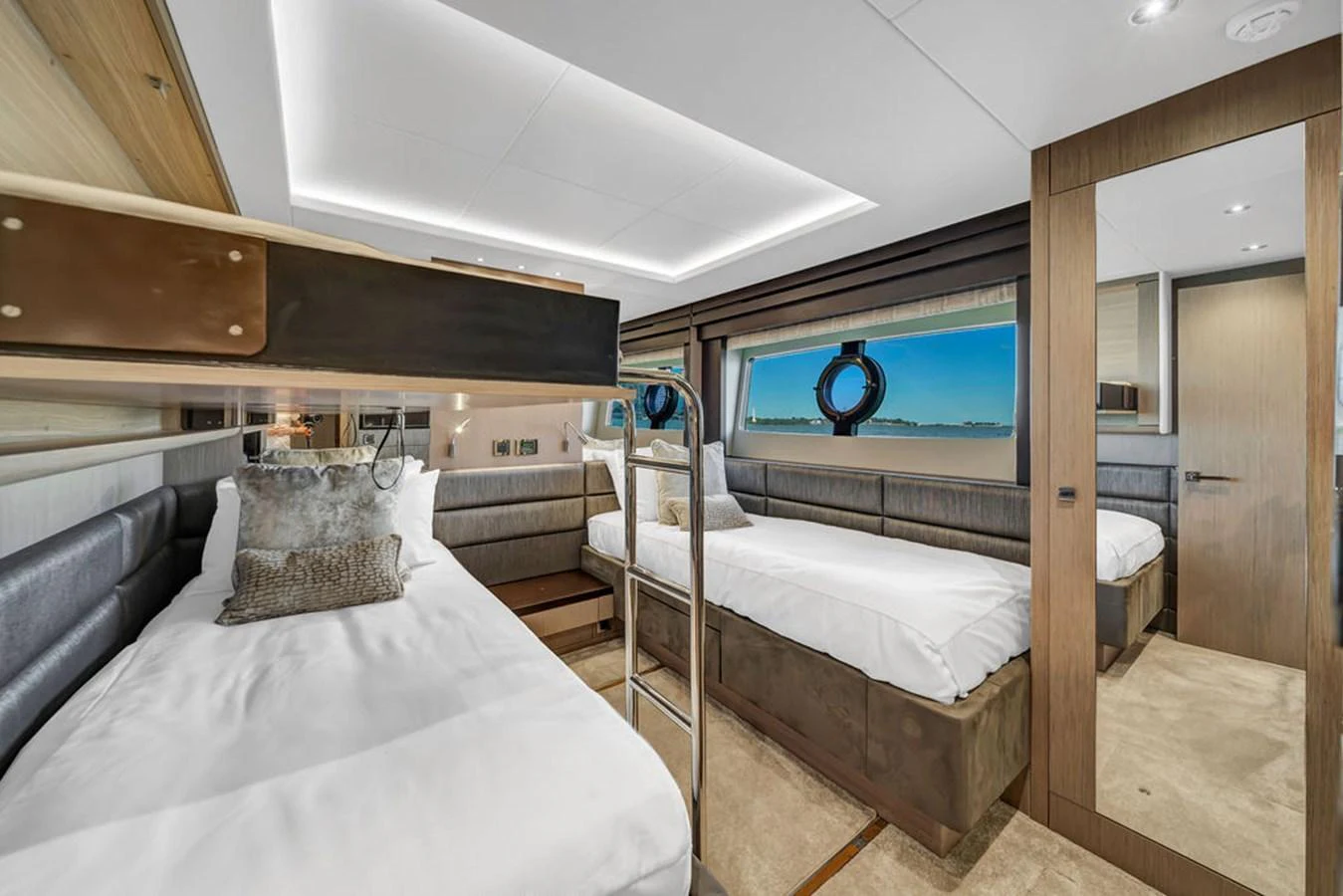 The guest stateroom features twin beds and a modern, elegant design with ample natural light. aboard SUNSEEKER Yacht for Sale