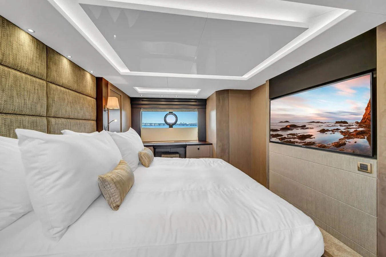 The stateroom features a luxurious bed with plush bedding and a large flat-screen TV for ultimate relaxation. aboard SUNSEEKER Yacht for Sale