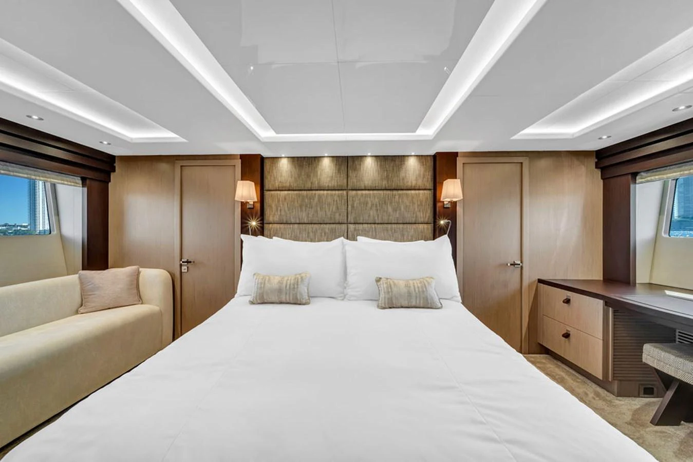 The master stateroom features a luxurious bed with elegant lighting and ample storage space. aboard SUNSEEKER Yacht for Sale