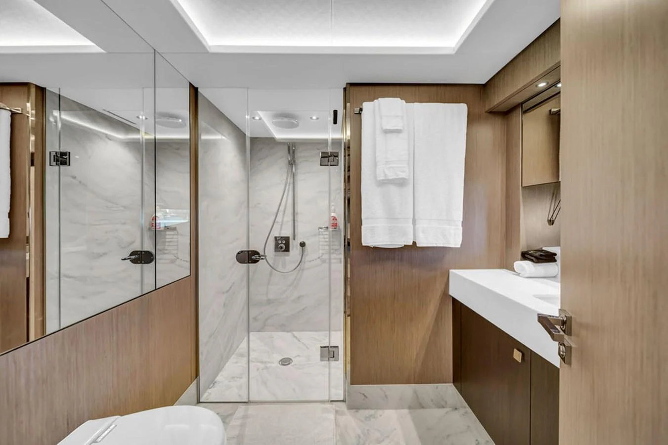 The yacht's bathroom features a modern design with a spacious shower and elegant fixtures. aboard SUNSEEKER Yacht for Sale
