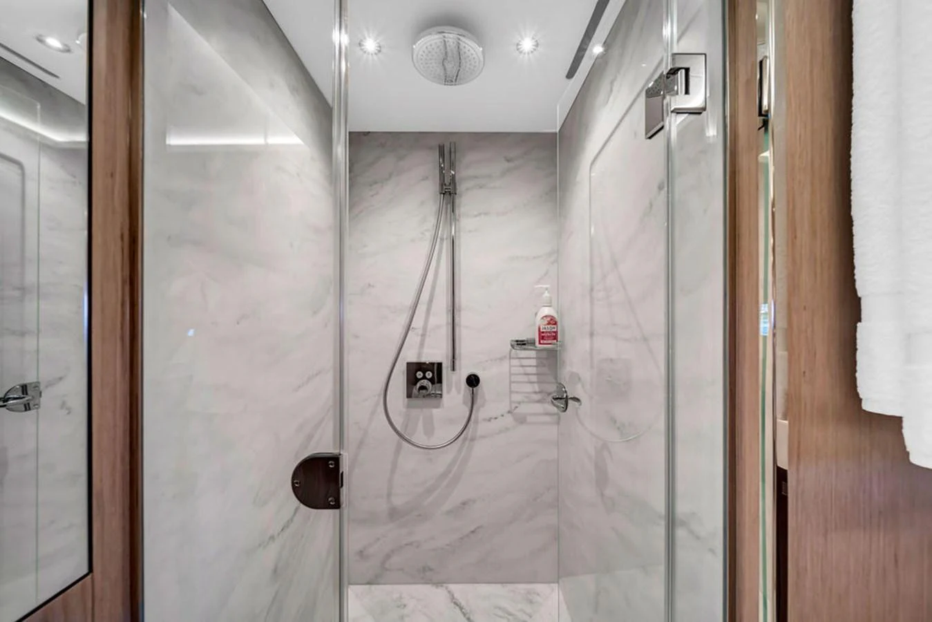 The yacht's bathroom features a sleek, modern shower with marble walls and high-end fixtures. aboard SUNSEEKER Yacht for Sale