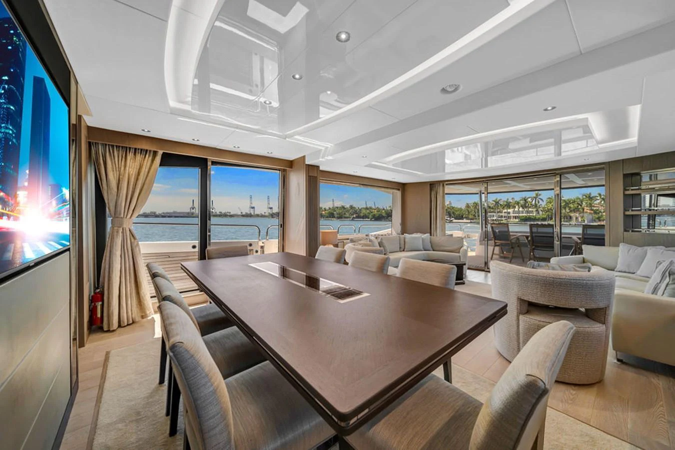 The spacious salon features elegant furnishings and panoramic windows offering stunning views. aboard SUNSEEKER Yacht for Sale