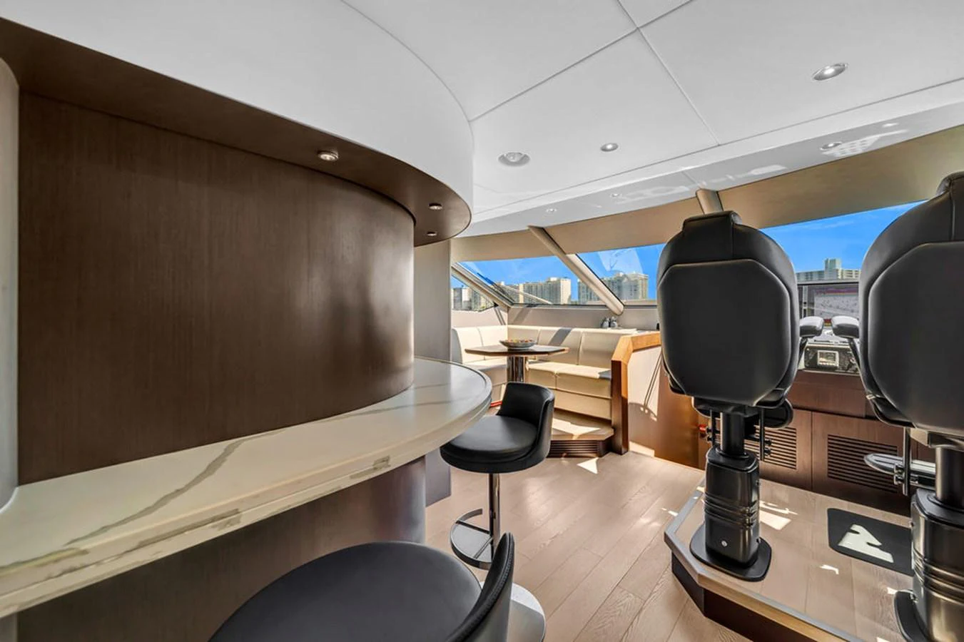 The helm area features modern seating and a sleek control panel with panoramic views. aboard SUNSEEKER Yacht for Sale