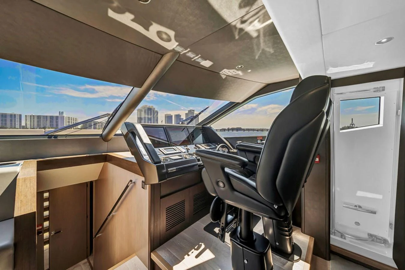 The helm station offers a commanding view with state-of-the-art navigation equipment and luxurious seating. aboard SUNSEEKER Yacht for Sale