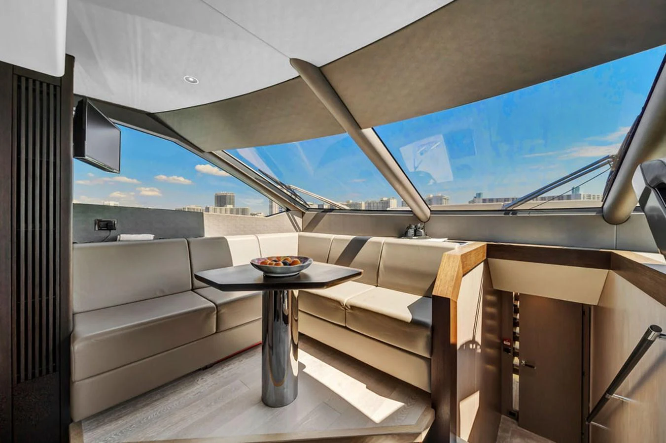The salon features a modern seating area with panoramic windows offering stunning views. aboard SUNSEEKER Yacht for Sale