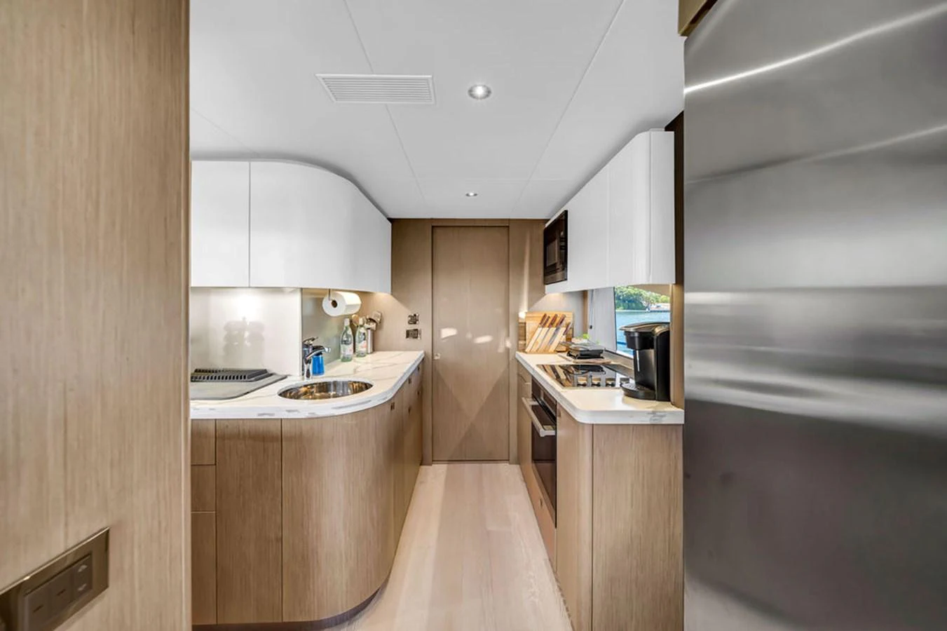 The yacht's galley features modern appliances and sleek cabinetry, offering a stylish and functional space for meal preparation. aboard SUNSEEKER Yacht for Sale